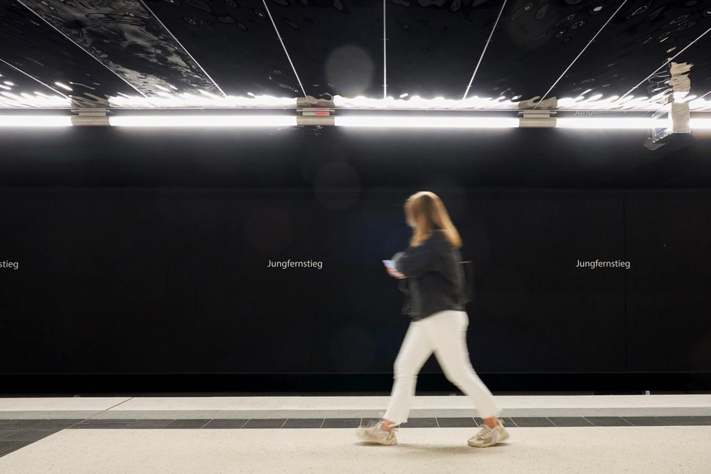 Emergency lighting is discreetly integrated into the lighting system.