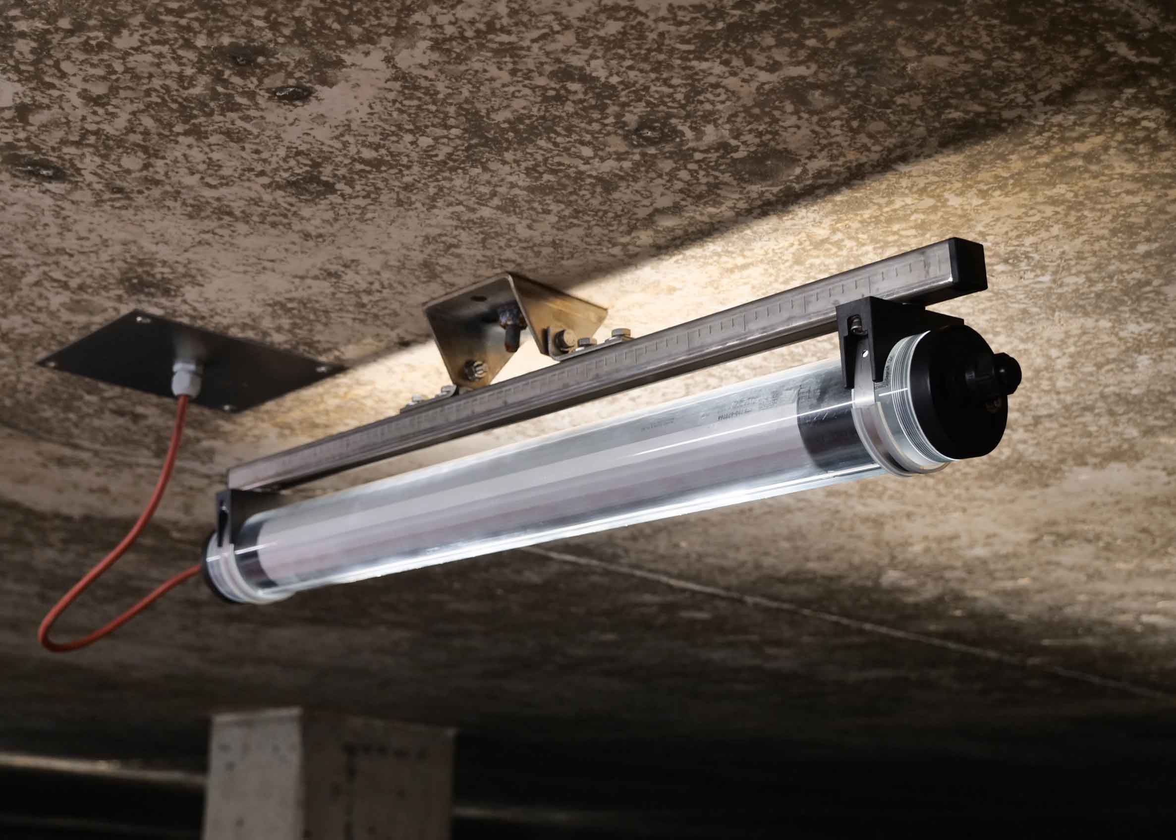 ZUG LED luminaire from NORKA installed in a drinking water storage tank, providing uniform illumination under high humidity; the luminaire is mounted on the ceiling.