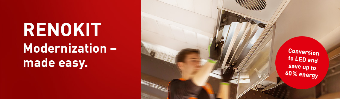 LED retrofit in a train station hall – modern LED lighting replaces outdated fluorescent tubes for improved energy efficiency, better illumination, and lower maintenance costs.